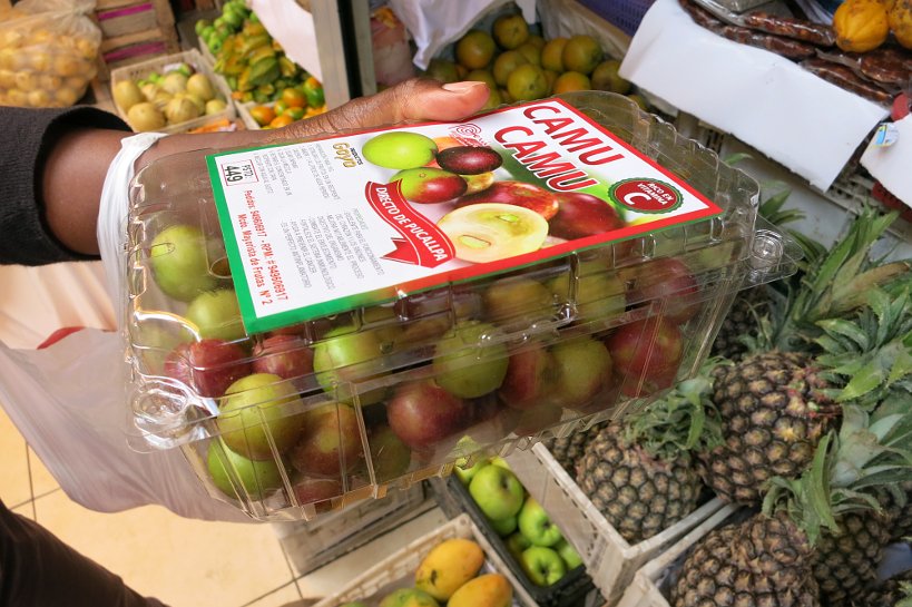 Peruvian fruits camu camu at the local market for desserts in Peru by Authentic Food Quest