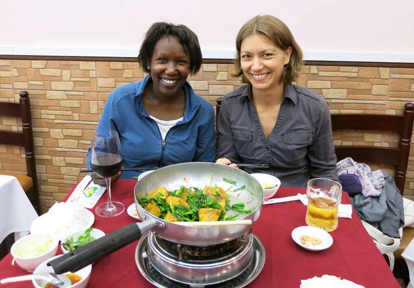 Rosemary and Claire savoring chả cá at Chả Cá Thảng Long Restaurant