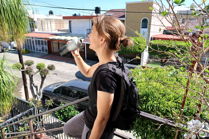 Claire Drinking Water using SIGG Bottle a great tip to Avoid Stomach Problems After Traveling by Authentic Food Quest