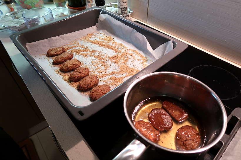 Dipping into syrup recipe for melomakarona by Authentic Food Quest