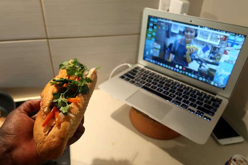 Rosemary showing her banh mi sandwich with The Chef and The Dish for Online Vietnamese Cooking Classes
