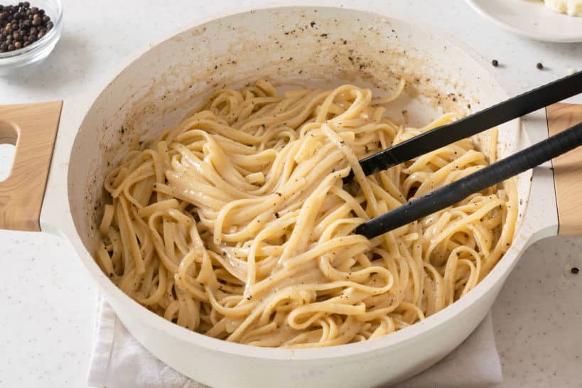 Mixing Pasta Traditional Cacio E Pepe Recipe by Authentic Food Quest