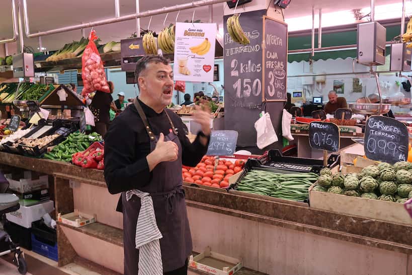 Chef Luis at local market during Paella Cooking Class In Valencia by Authentic Food Quest
