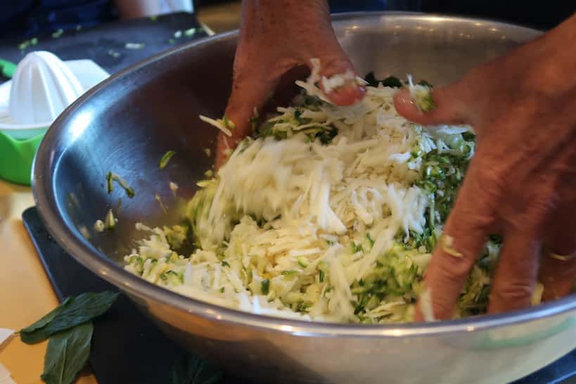 Squeezing Zucchini By Hand Cooking Class In Athens by Authentic Food Quest