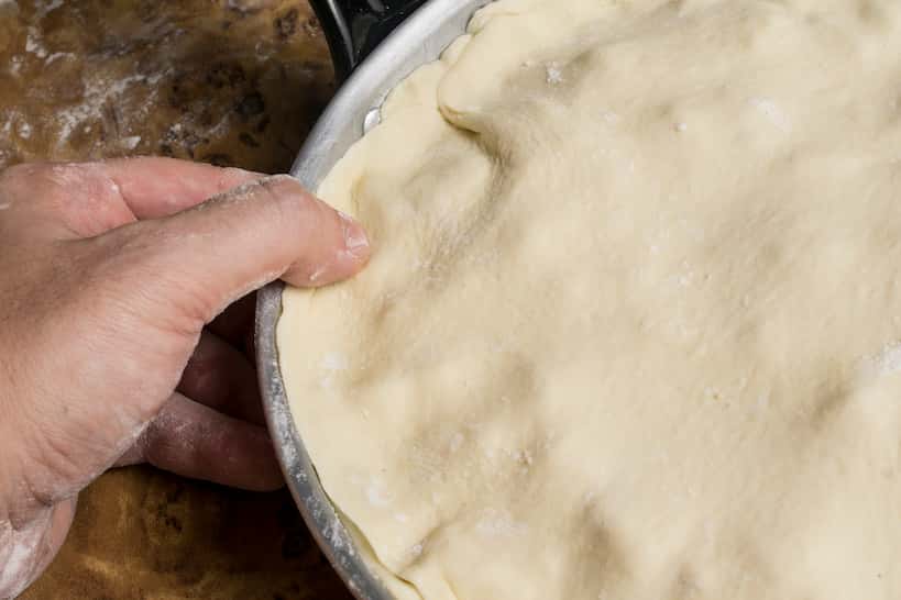 Press the edges Fugazzeta Argentinian Pizza by Authentic Food Quest